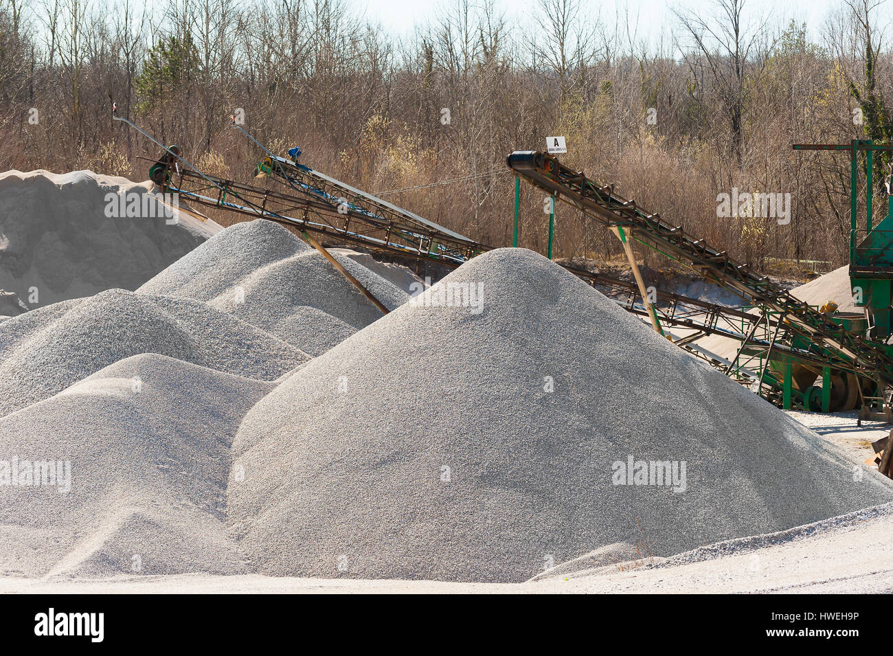 Extraction gravel. Machinery distribution and classification by size gravel. Conveyors for transporting gravel.Gravel quarry. Construction industry. Stock Photo
