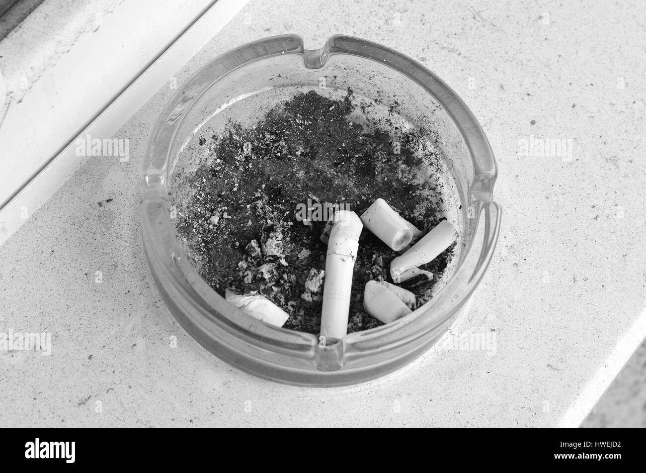 Ashtray full of cigarettes burn Stock Photo