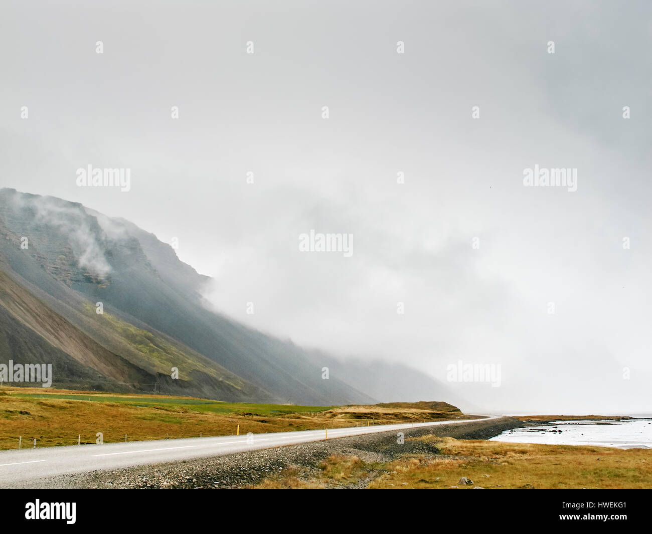 Low cloud on mountainside, Hof, Iceland Stock Photo