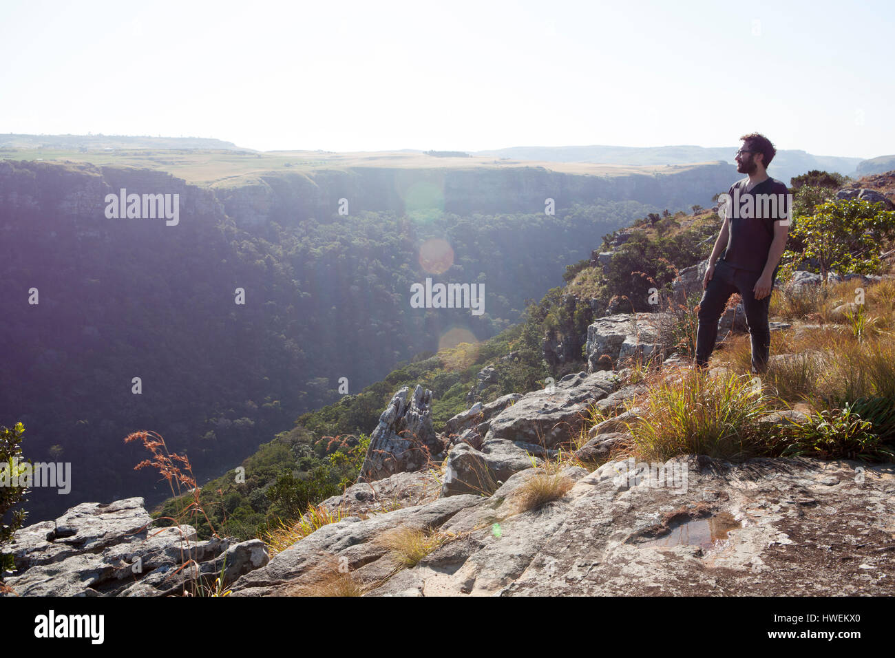 Man standing on mountain top hi-res stock photography and images - Alamy