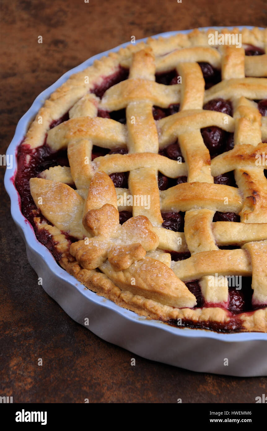 cherry pie dough with decorative ornaments in  roasting pan close-up Stock Photo
