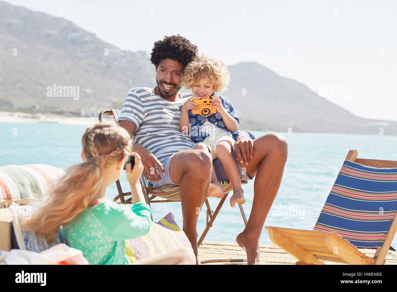 Family on houseboat deck, Kraalbaai, South Africa Stock Photo
