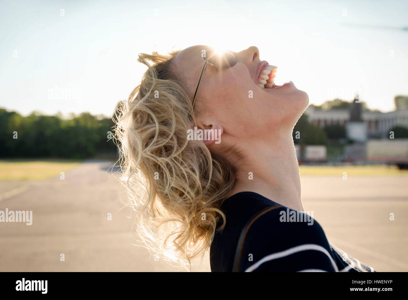 Blond woman throwing head back hires stock photography and images Alamy
