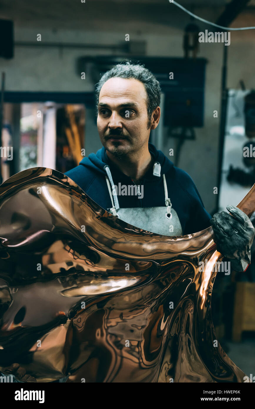 Blacksmith workshop man holding metal hi-res stock photography and ...