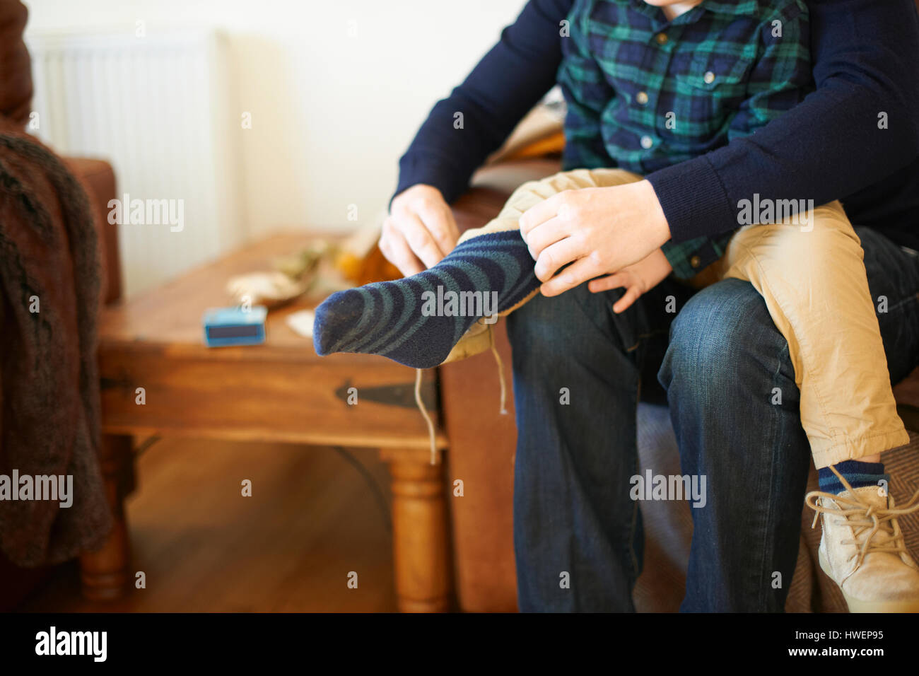 Child getting dressed socks hires stock photography and images Alamy