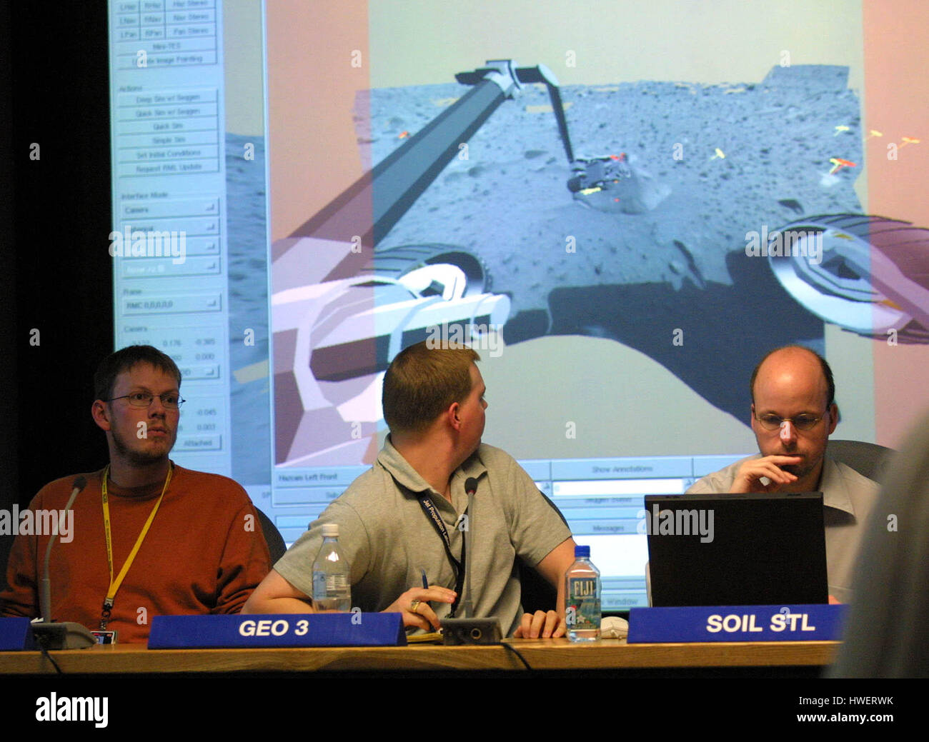 Scientists look at a projection of a computer model of the Mars Rover Spirit at the Jet Propulsion Laboratory in Pasadena, California  during a science working group meeting on Tuesday, 20 January 2004. Scientists plan the next stages for the Mars Rover Spirit in these daily meetings. Photo by Francis Specker Stock Photo