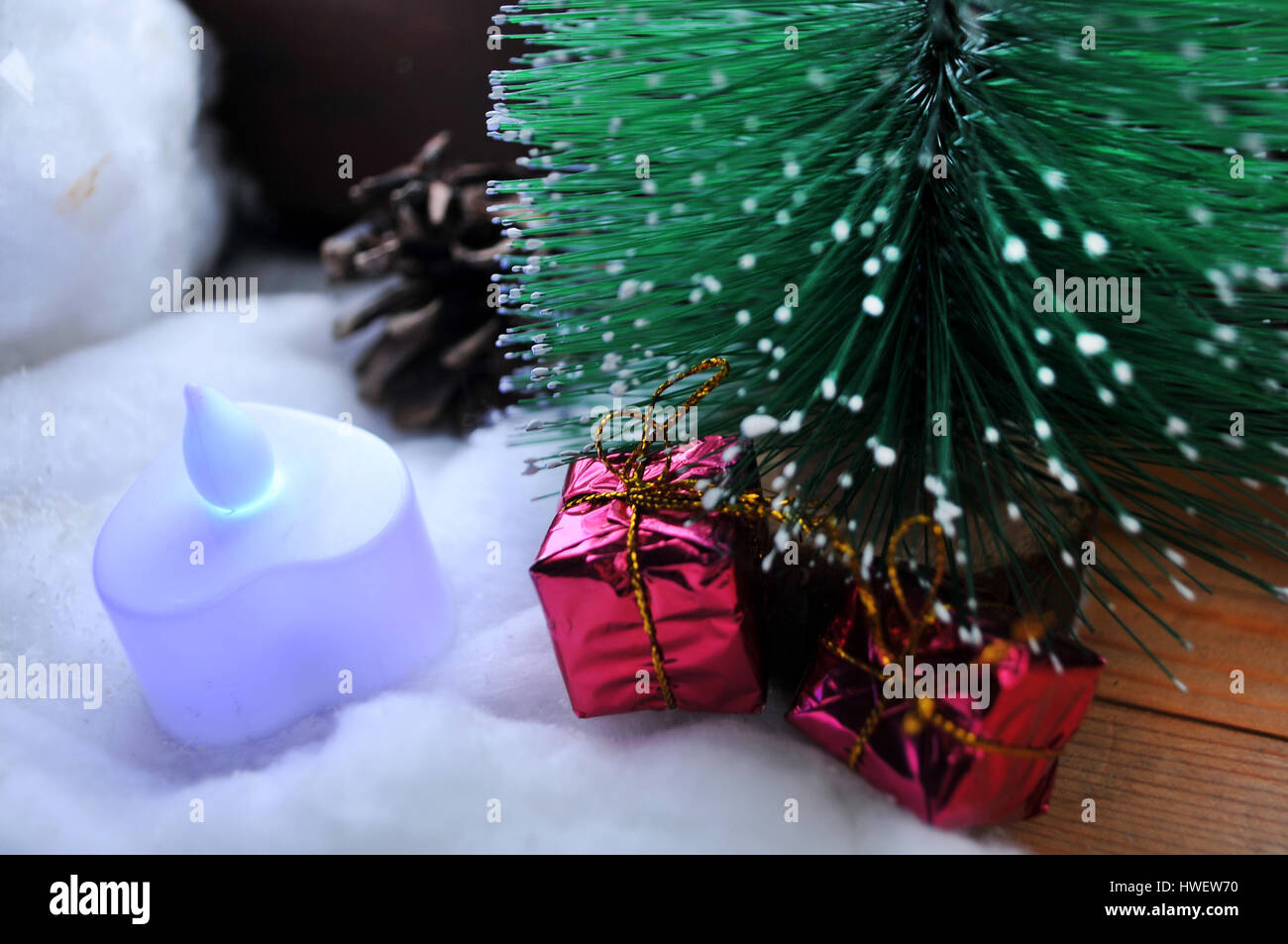 Christmas tree next to a cold window overlooking the trees with