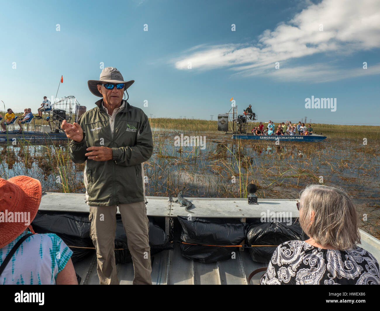 Tourist Enjoy An Airboat Ride At Sawgrass Recreation Park Hoping To See Wild Florida Everglades Alligators Stock Photo