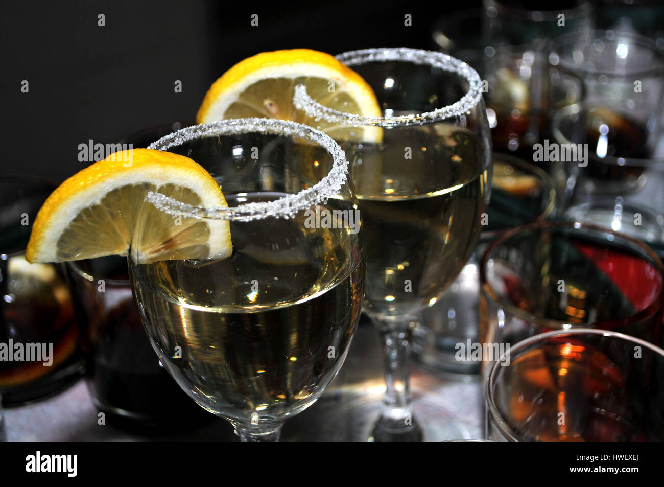 Focused glass of vermouth with a slice of lemon, thinly lined top of the glass with a layer of sweet sugar in the restaurant, Novi Sad, Serbia Stock Photo