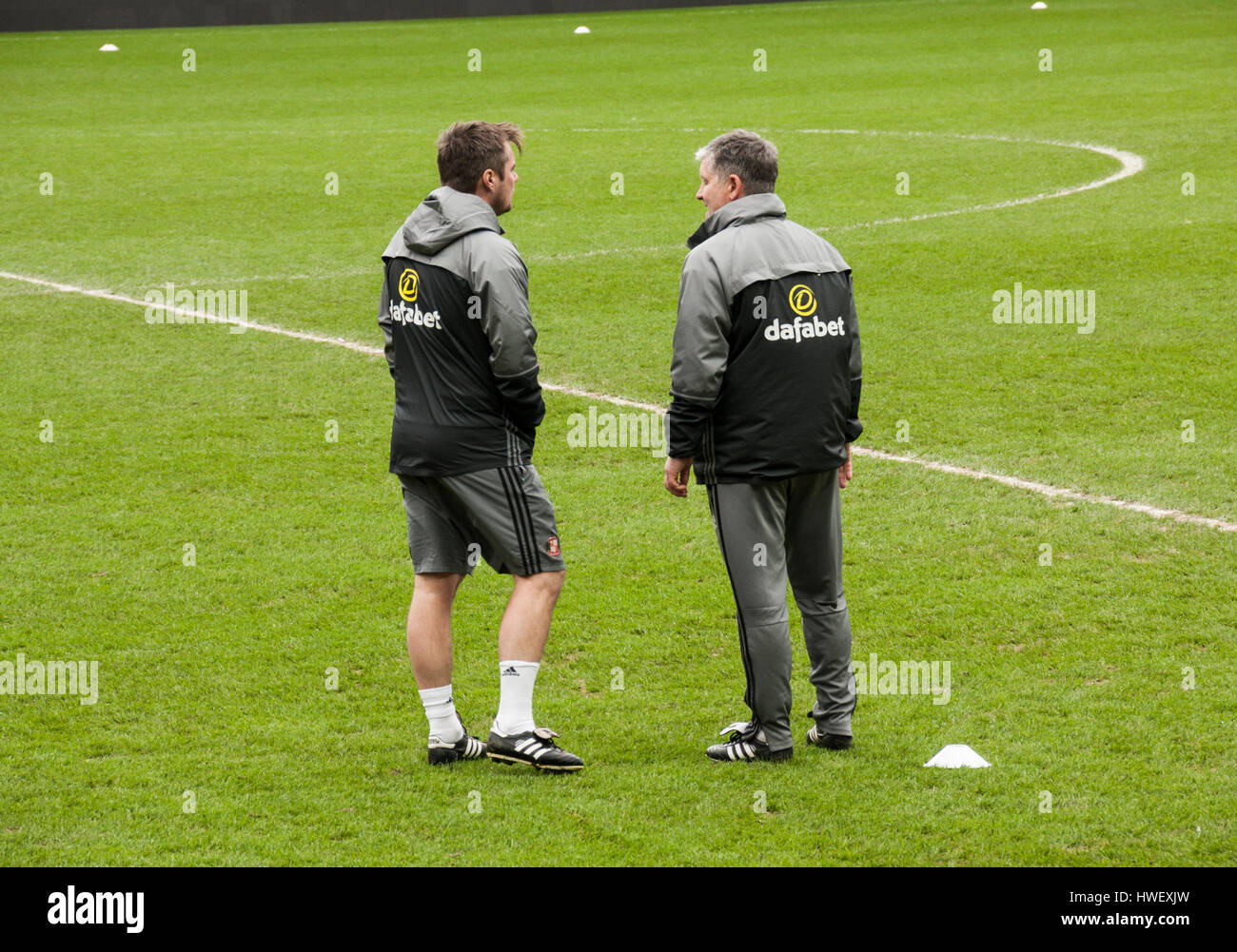 Coaches, Paul Bracewell and Robbie Stockdale, chatting before a training session at the Stadium of Light,Sunderland,England Stock Photo