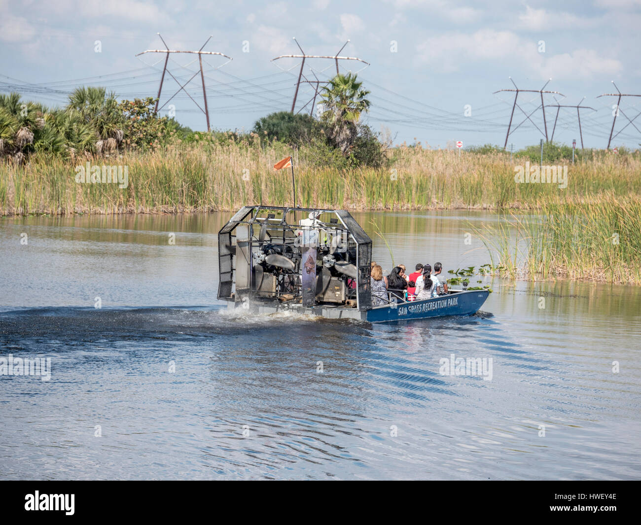 Tourist Enjoy An Airboat Ride At Sawgrass Recreation Park Hoping To See