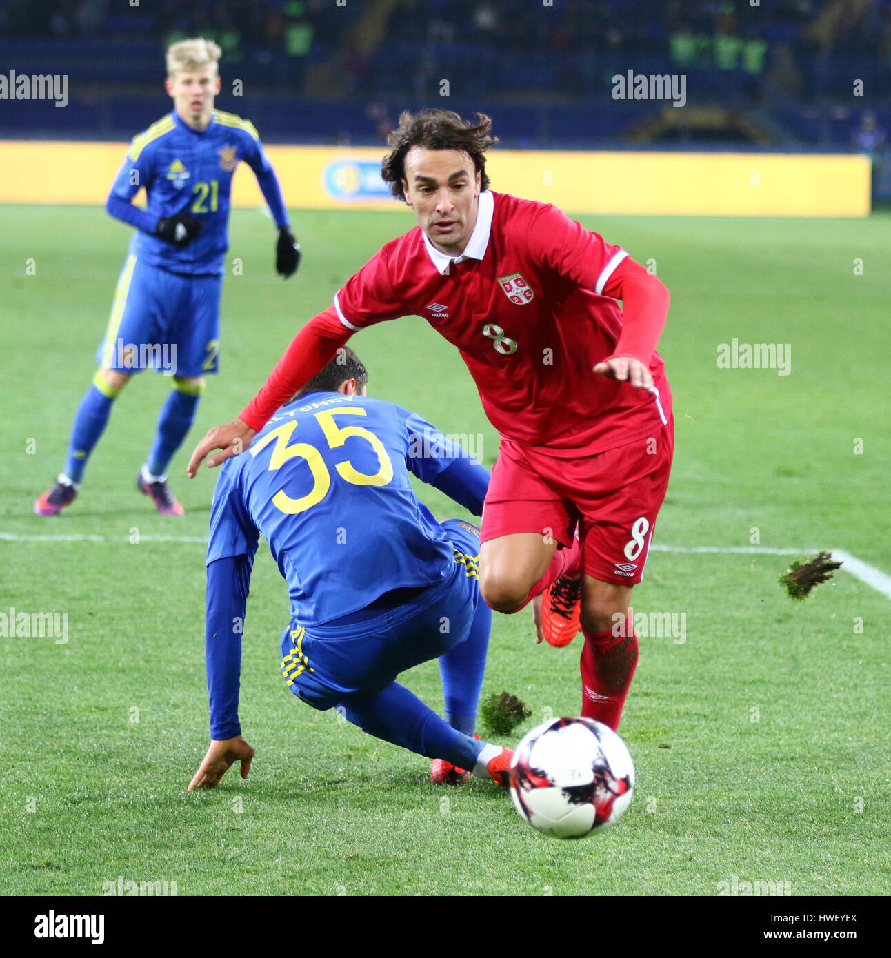 Kharkiv, Ukraine - November 15, 2016: Lazar Markovic of Serbia (in Red) fights for a ball with Maksym Malyshev of Ukraine during their Friendly match  Stock Photo