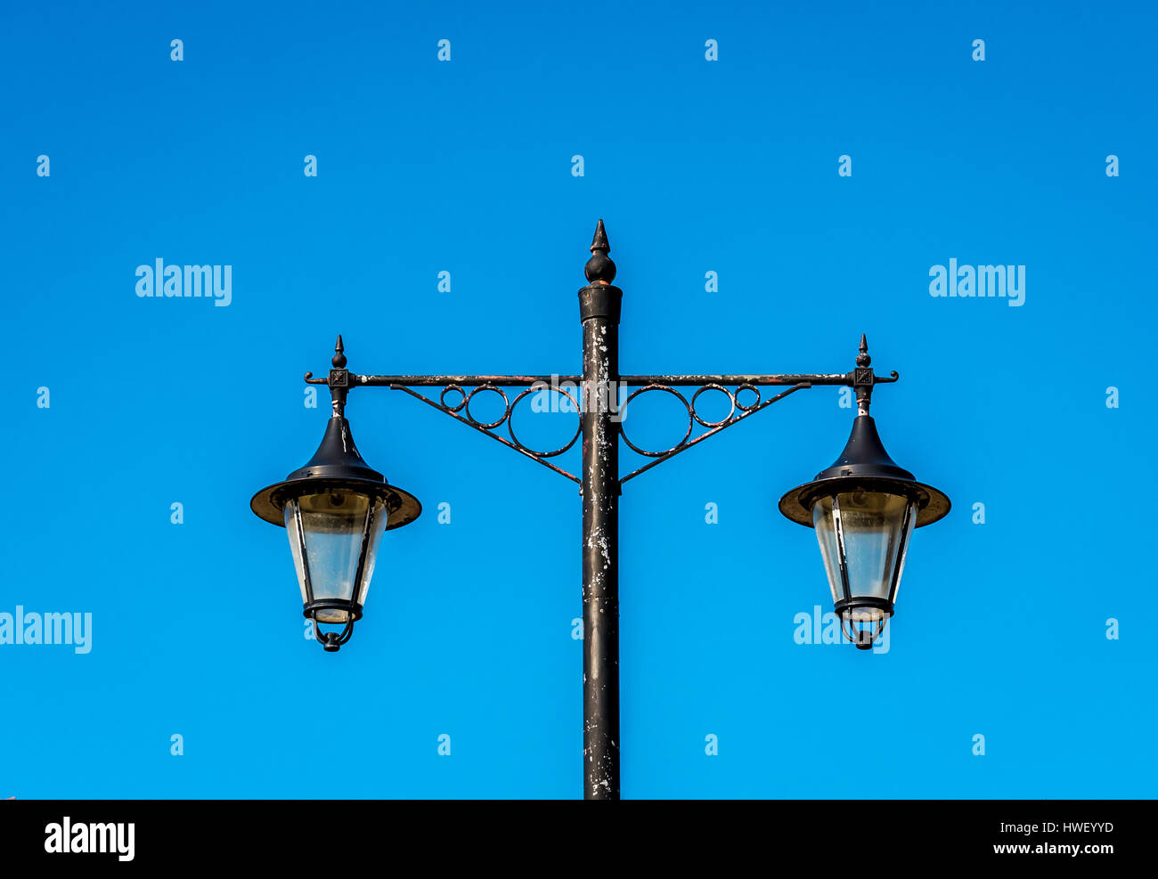 Old fashioned Victorian street lights centred against clear blue sky, Haddington, East Lothi, Scotland, UK Stock Photo