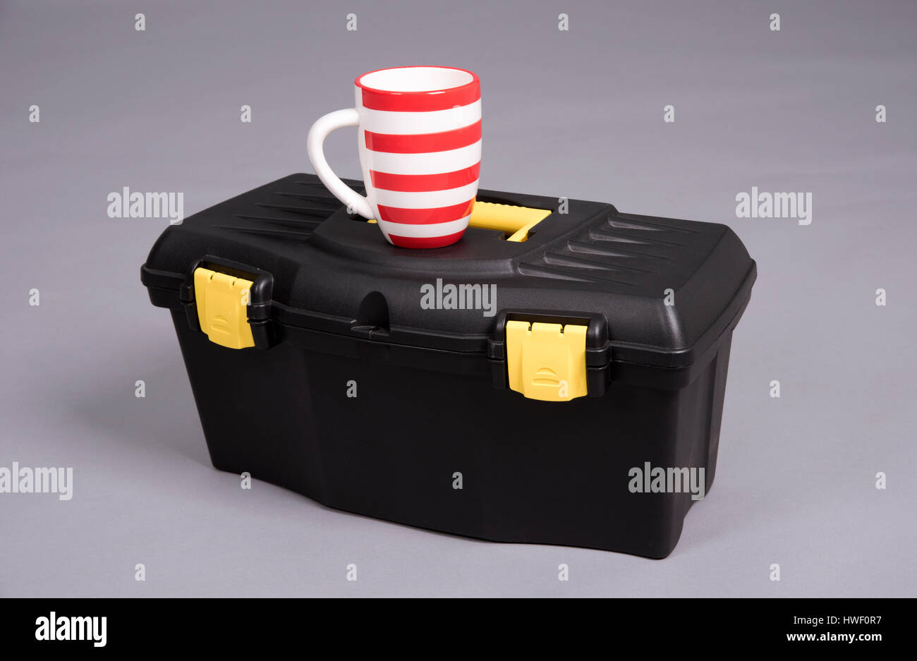 Toolbox and a drinks mug Stock Photo