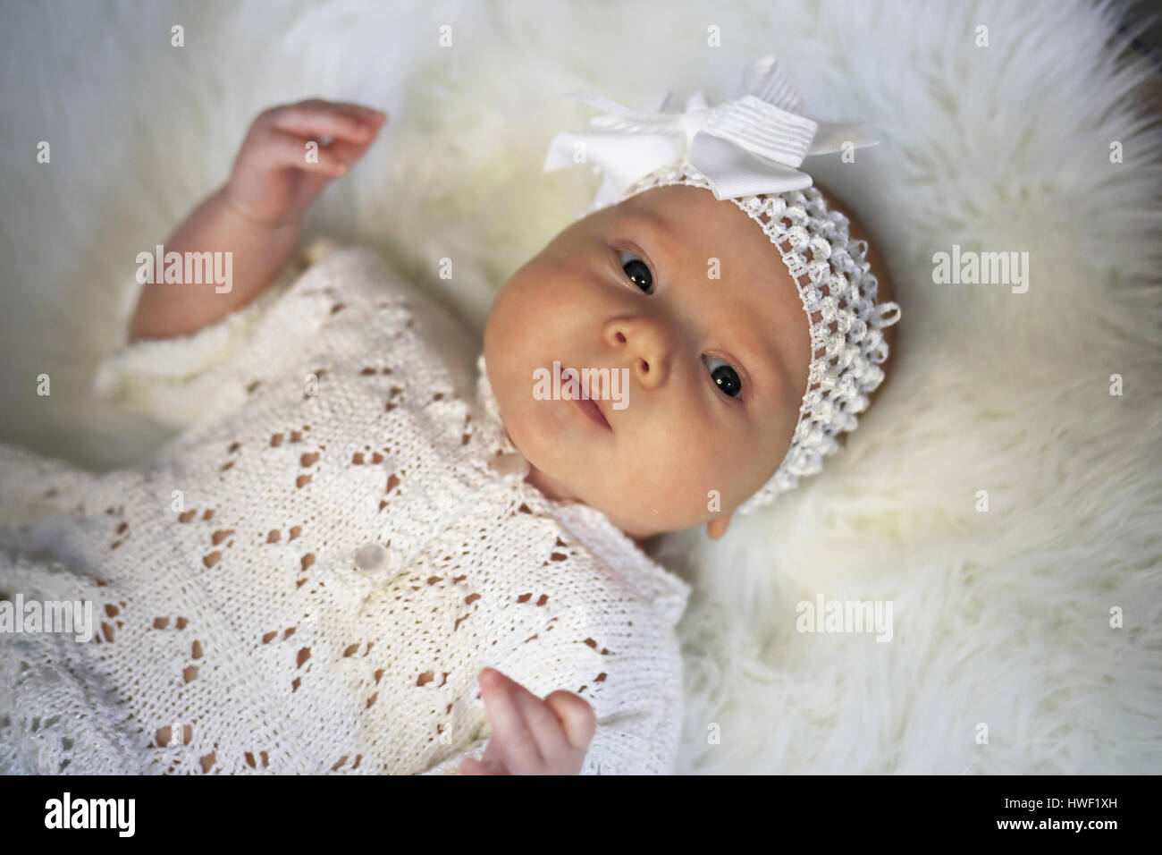 portrait of a beautiful baby girl in a white dress Stock Photo - Alamy