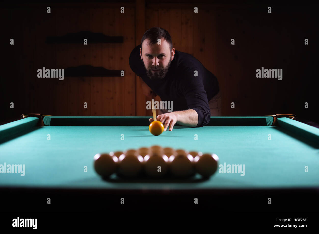 hansome man playing billiards alone Stock Photo Alamy