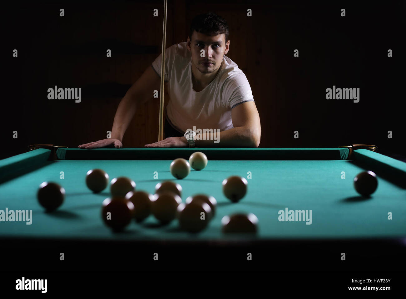 hansome man playing billiards alone Stock Photo Alamy