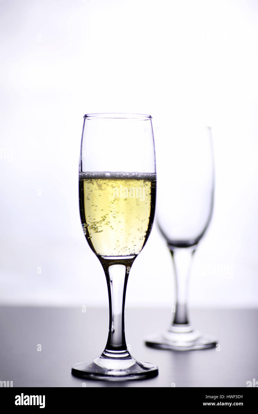 glass of white wine on a table on white background isolate Stock Photo ...
