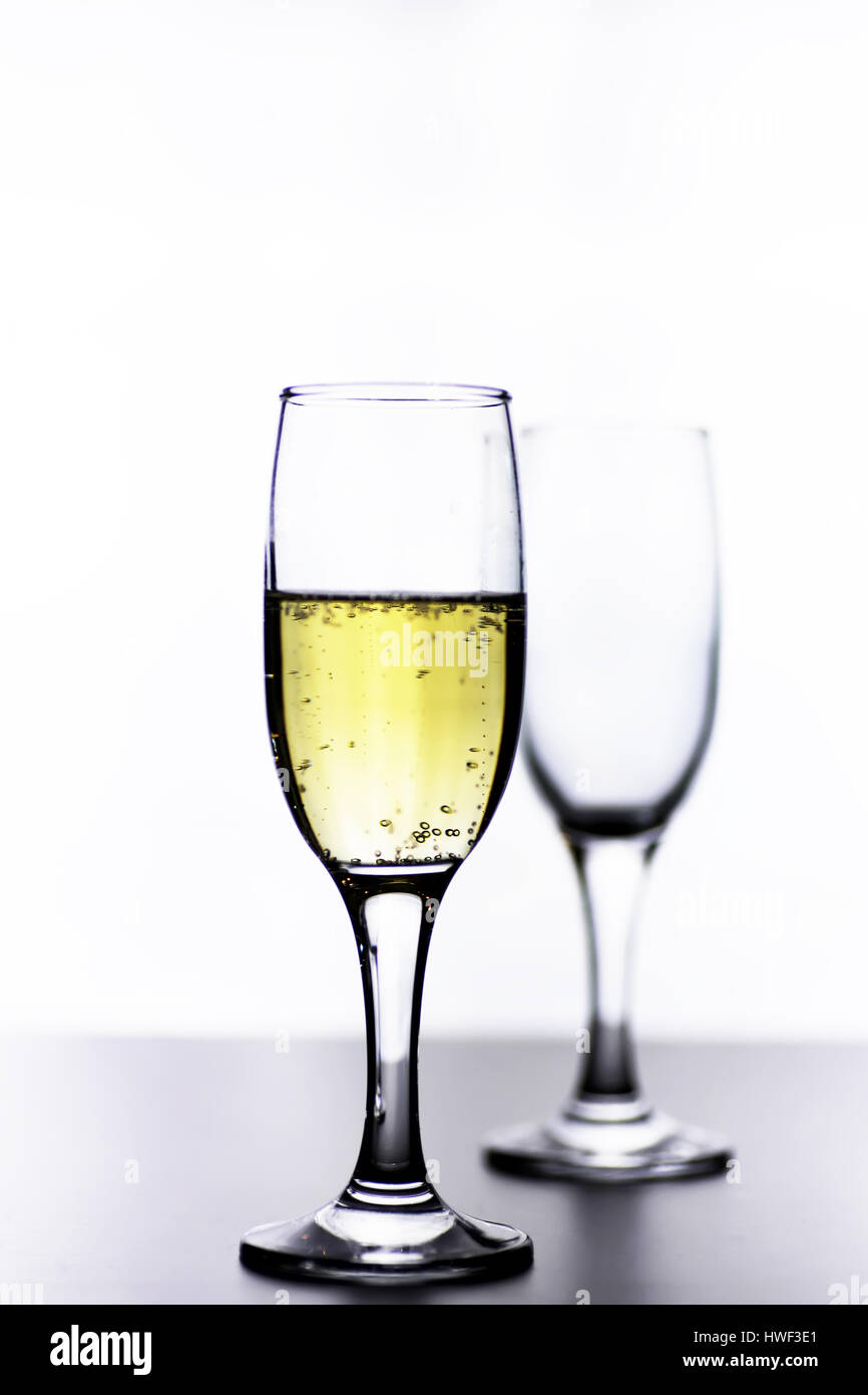 glass of white wine on a table on white background isolate Stock Photo ...