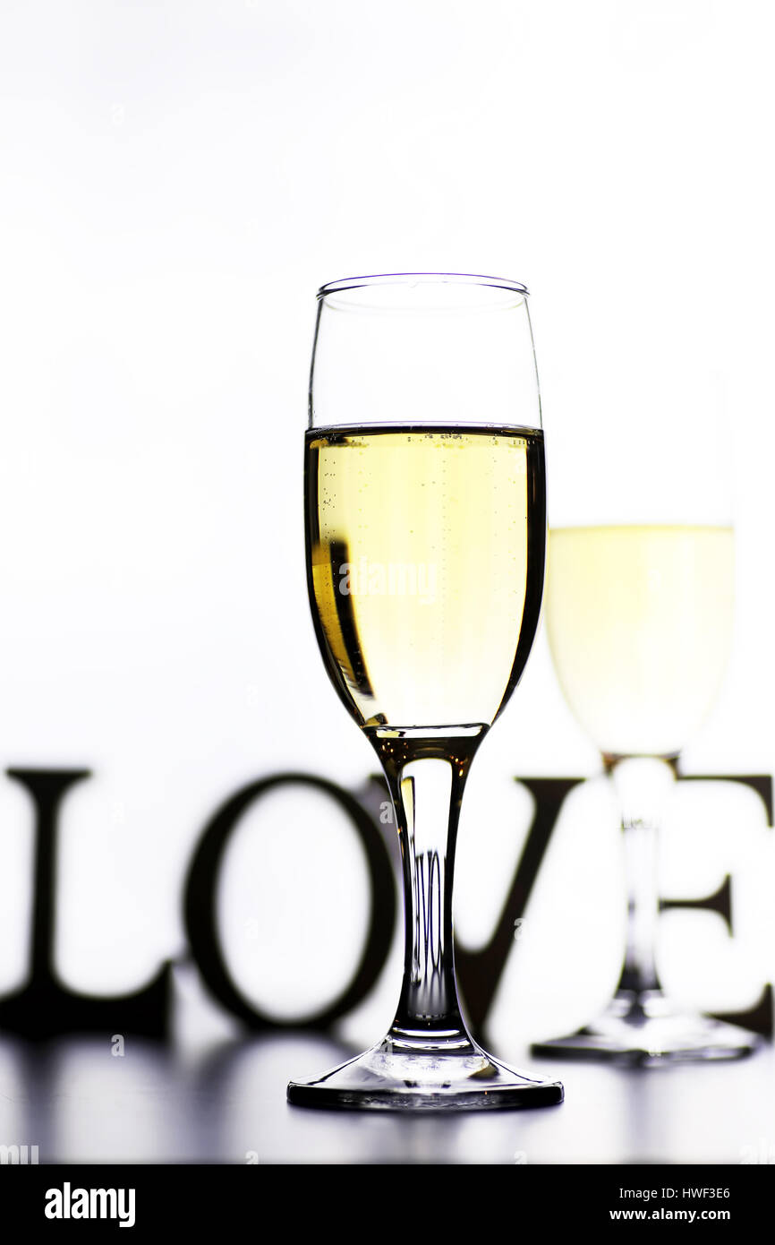 glass of white wine on a table on white background isolate Stock Photo ...