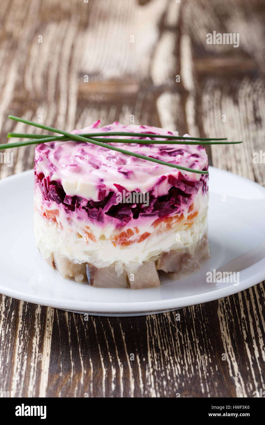 Homemade dressed pickled herring, traditional russian layered salad herring under a fur coat Stock Photo
