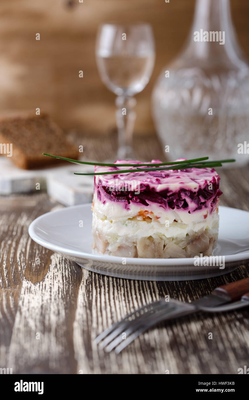 Homemade dressed pickled herring, traditional russian layered salad