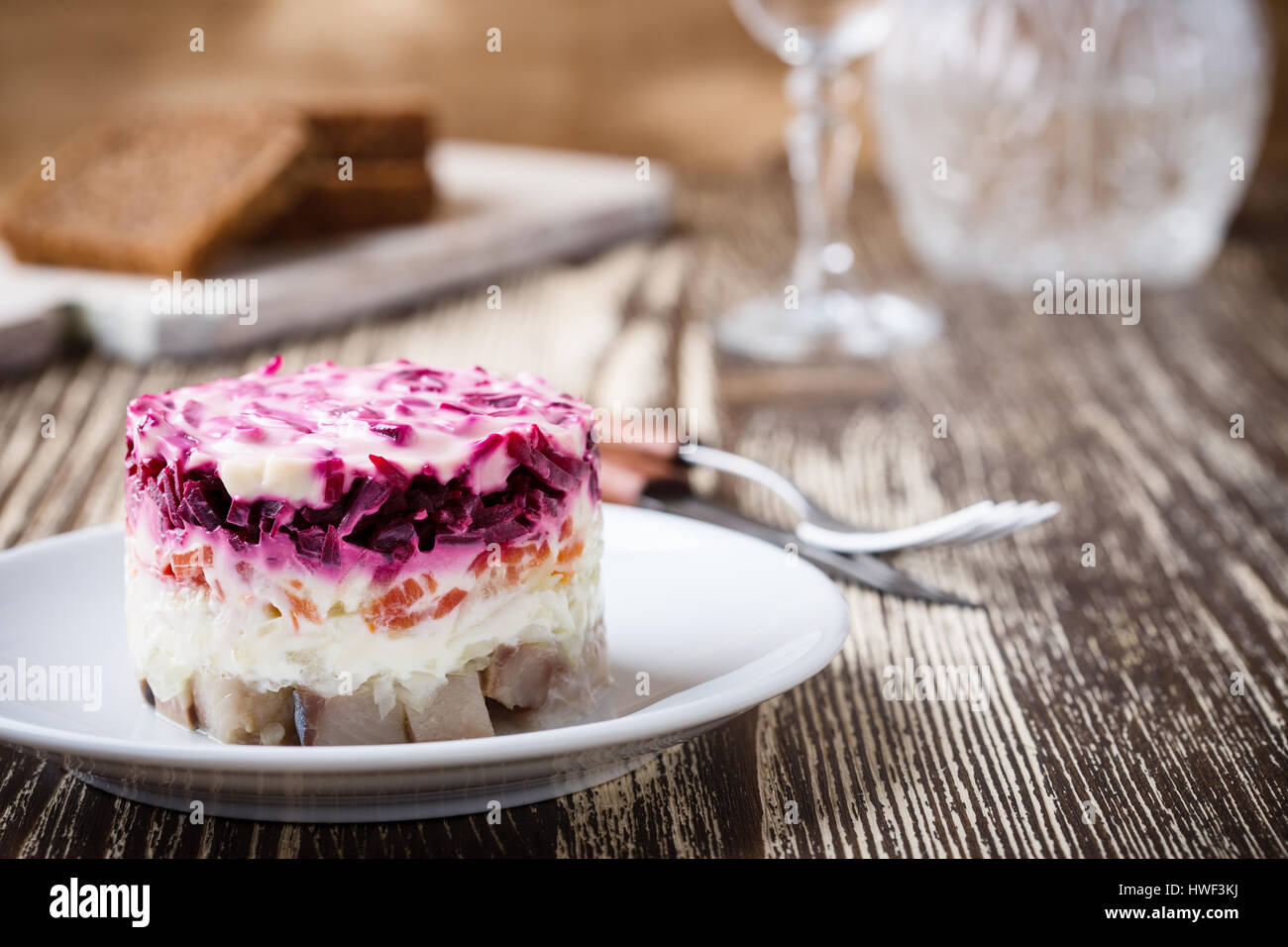 Homemade dressed pickled herring, traditional russian layered salad herring under a fur coat Stock Photo