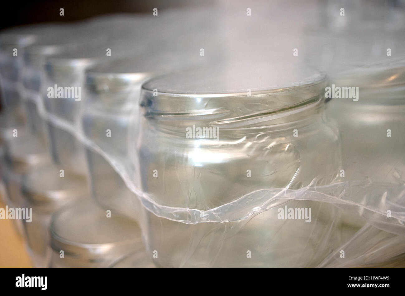 Lots of glass bottles for a variety of juices and jams Stock Photo Alamy