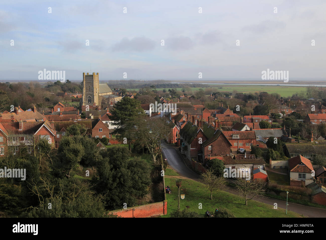 Orford Ness shingle spit view over rooftops of village houses, Orford