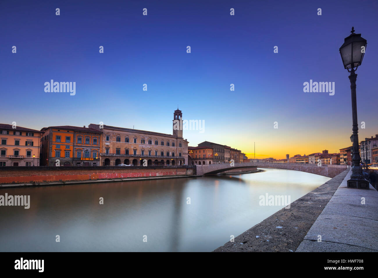Pisa, Arno river, Ponte di Mezzo bridge and street lamp. Lungarno view. Long Exposure. Tuscany, Italy, Europe. Stock Photo