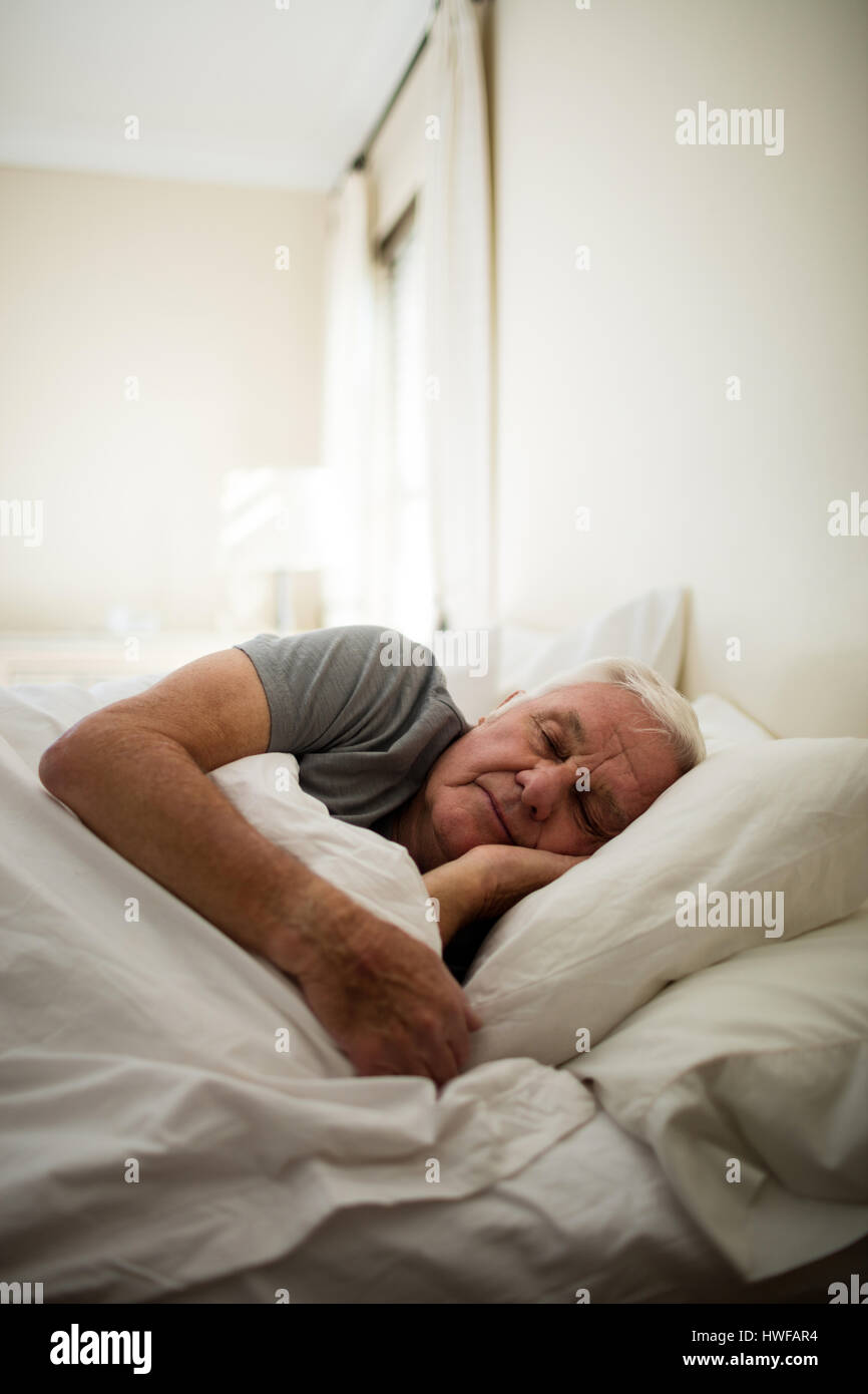 Senior man sleeping in the bedroom at home Stock Photo - Alamy