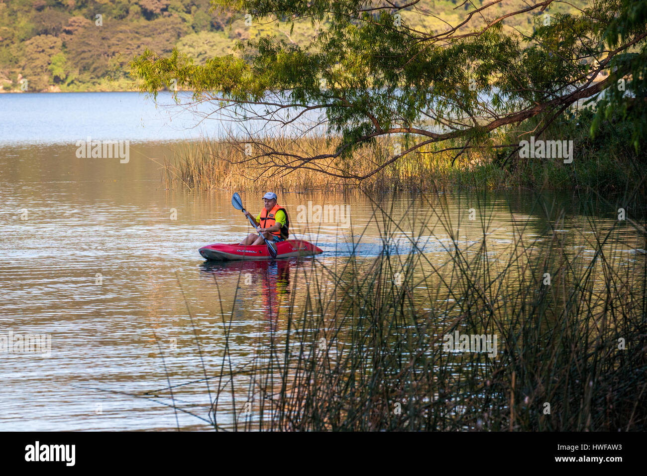 Kayaker explores the lake at Santa Maria del Oro in Nayarit, Mexico. Stock Photo