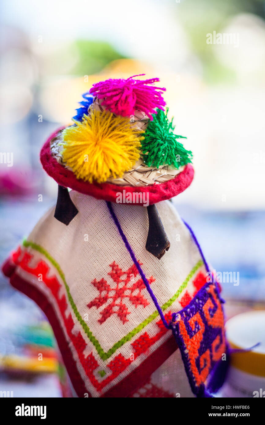 Huichol doll looks out on the market in Tepic, Nayarit, Mexico. Stock Photo