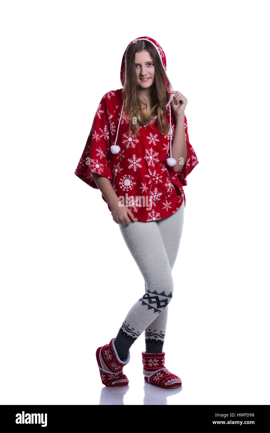 Lovely cheerful teenage girl posing in the studio. Wearing red winter hoodie with snowflakes. Isolated on white background. Winter clothes Stock Photo