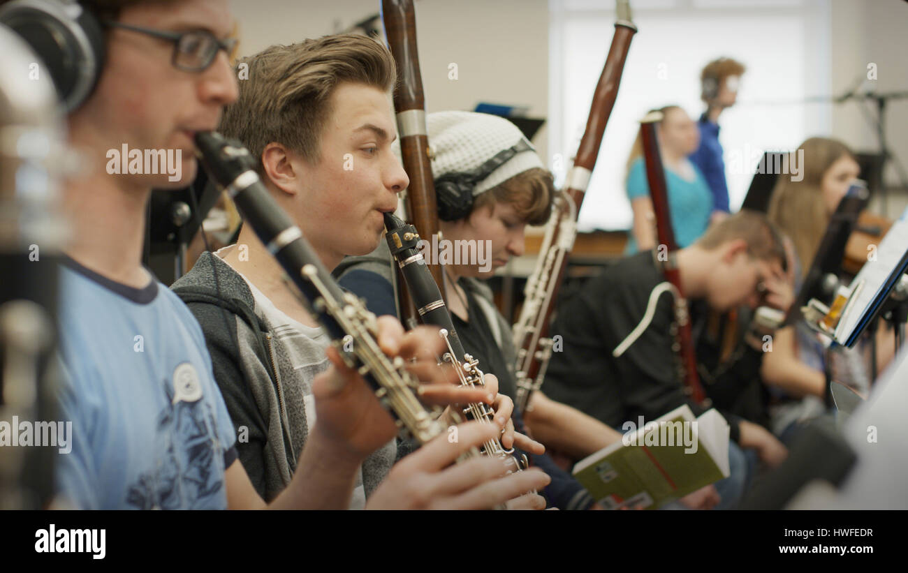 Selective focus view of serious teenage boy musician playing
