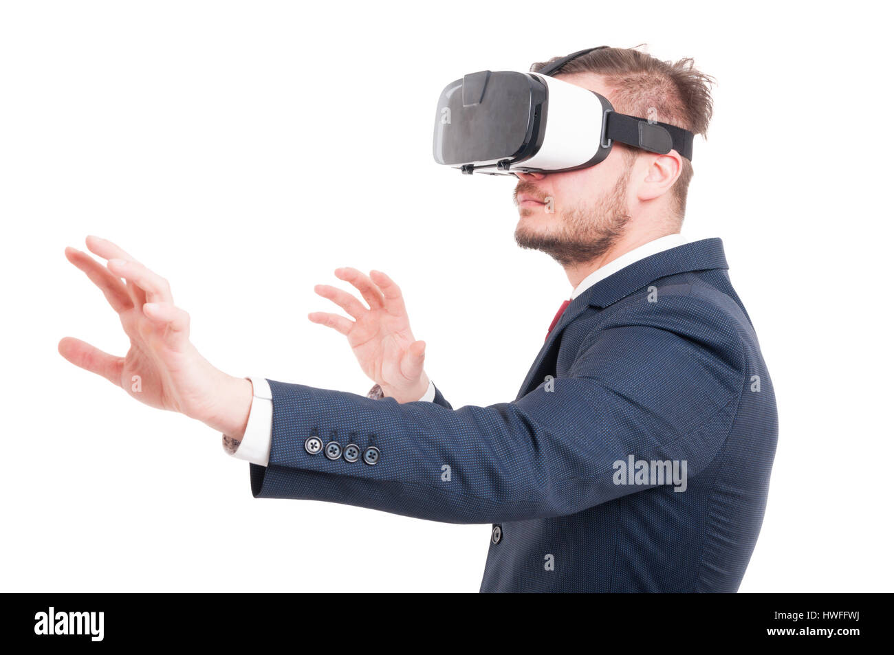 Attractive young businessman wearing vr glasses as virtual reality concept isolated on white background Stock Photo