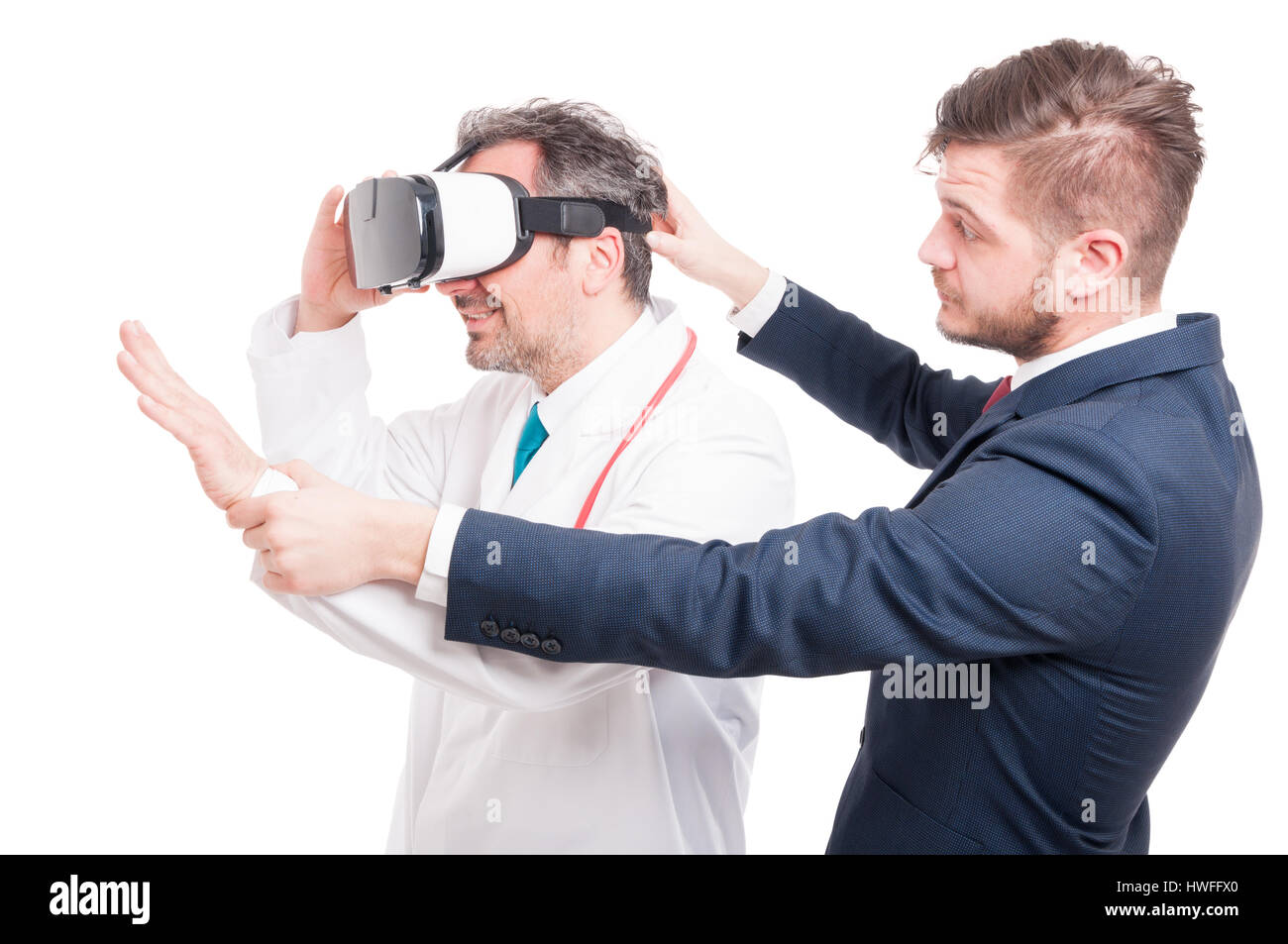 Handsome businessman with young medic looking through vr headset isolated on white Stock Photo