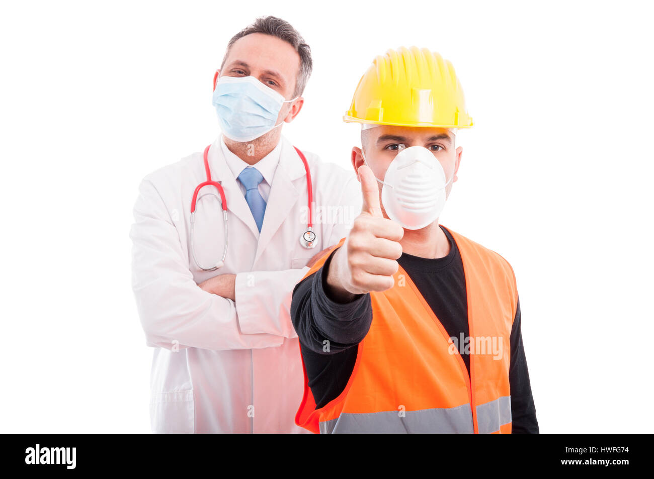 Trustworthy constructor and doctor showing thumb up being confident isolated on white background Stock Photo