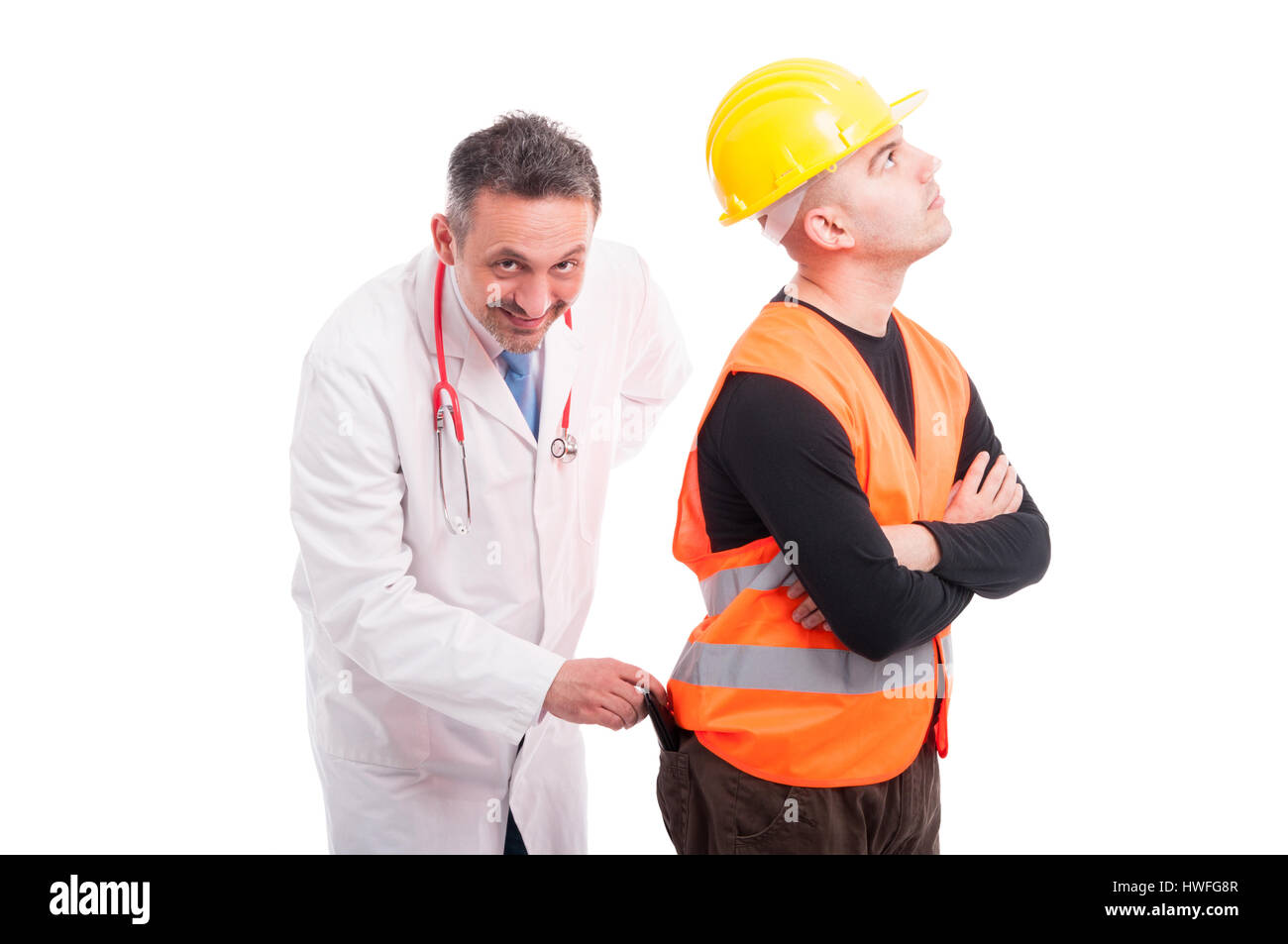 Doctor stealing constructors wallet from back pocket and smiling isolated on white background Stock Photo