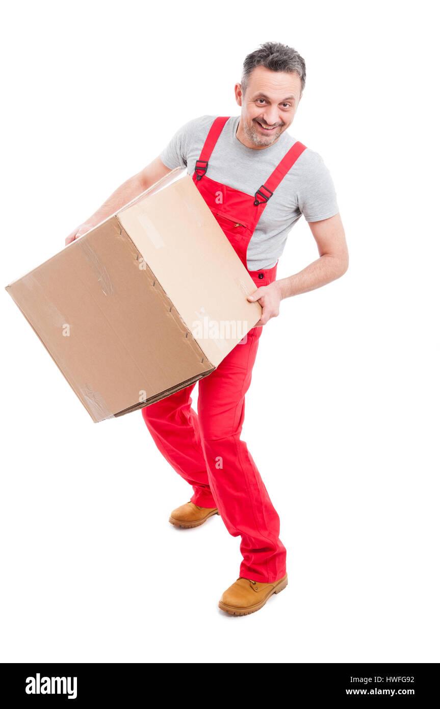 Full body of delivery guy holding big cardboard box like moving concept and smiling isolated on white background Stock Photo