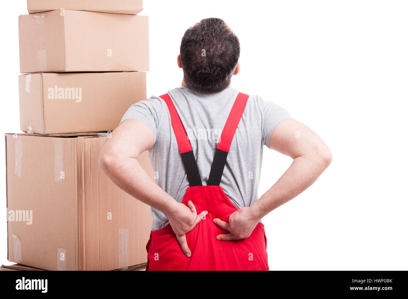 Back view of mover man holding his back like hurting isolated on white background Stock Photo