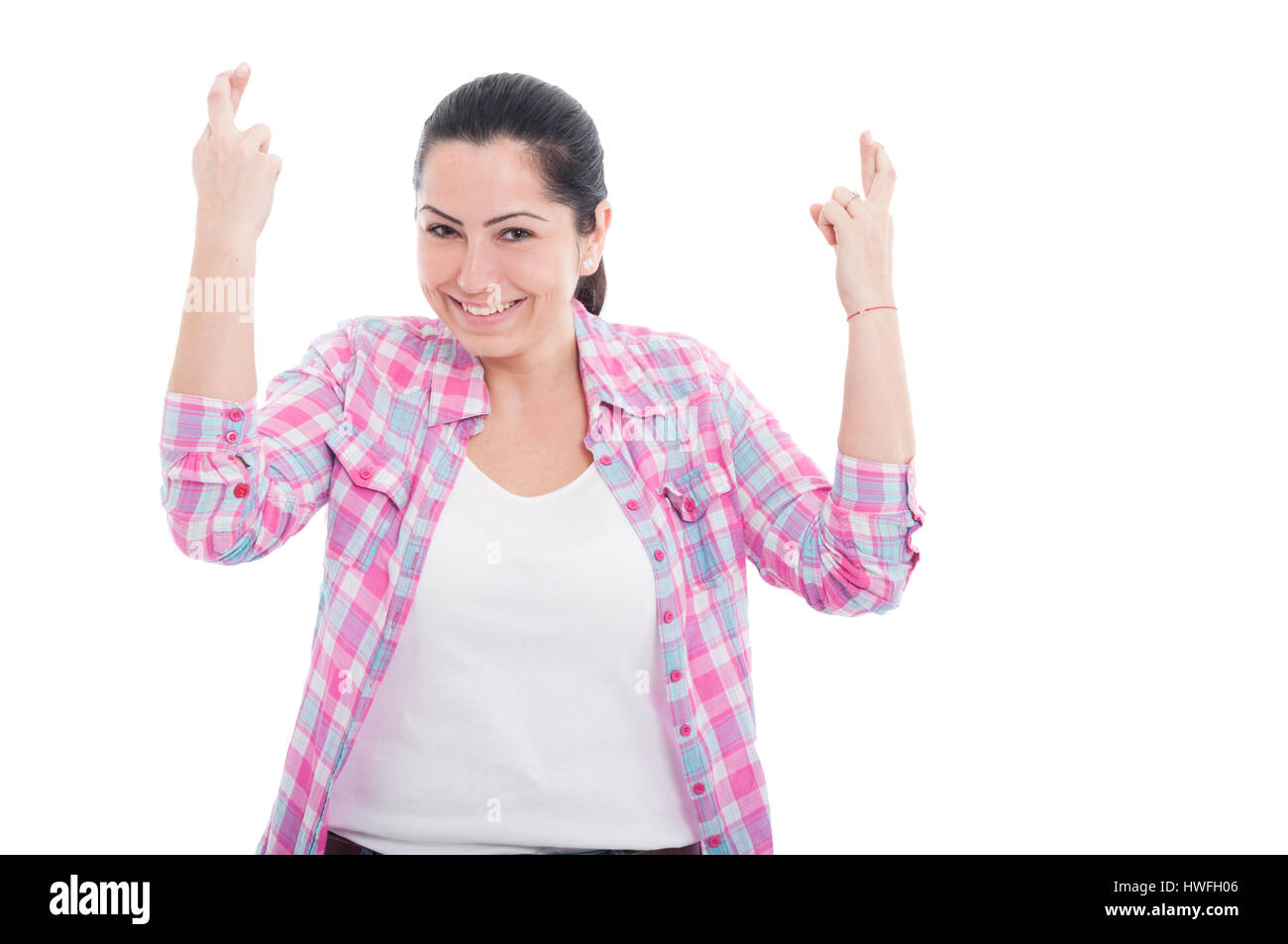 Portrait Of Joyful Woman Wishing Luck With Crossed Fingers From Both