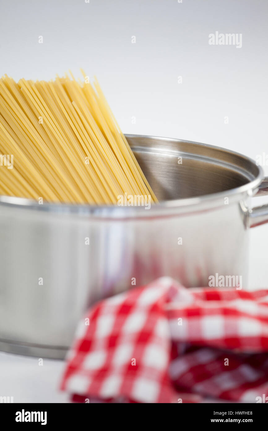 Spaghetti pasta in utensil on white background Stock Photo Alamy