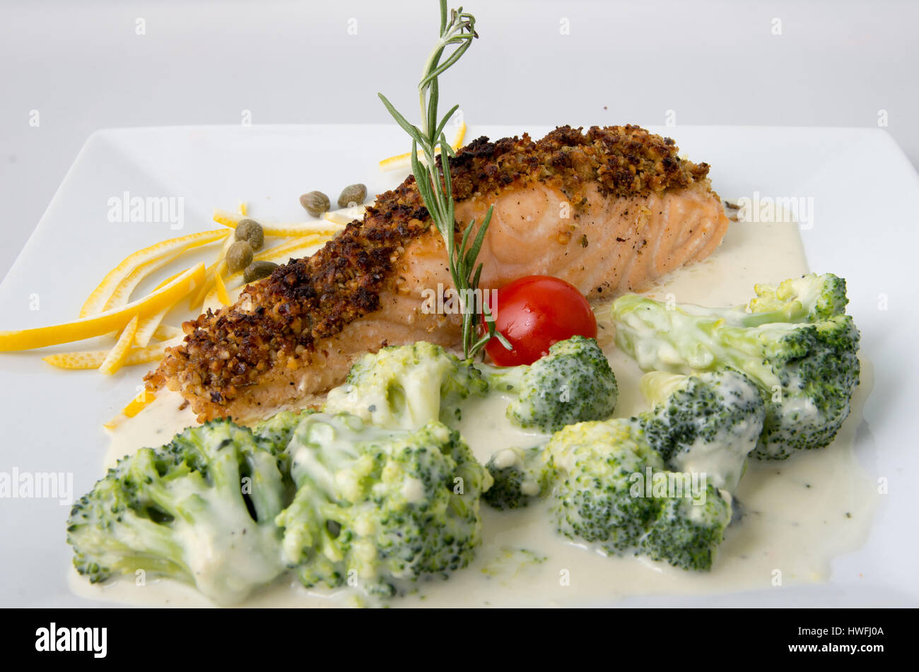 Fish with broccoli in cream sauce Stock Photo Alamy