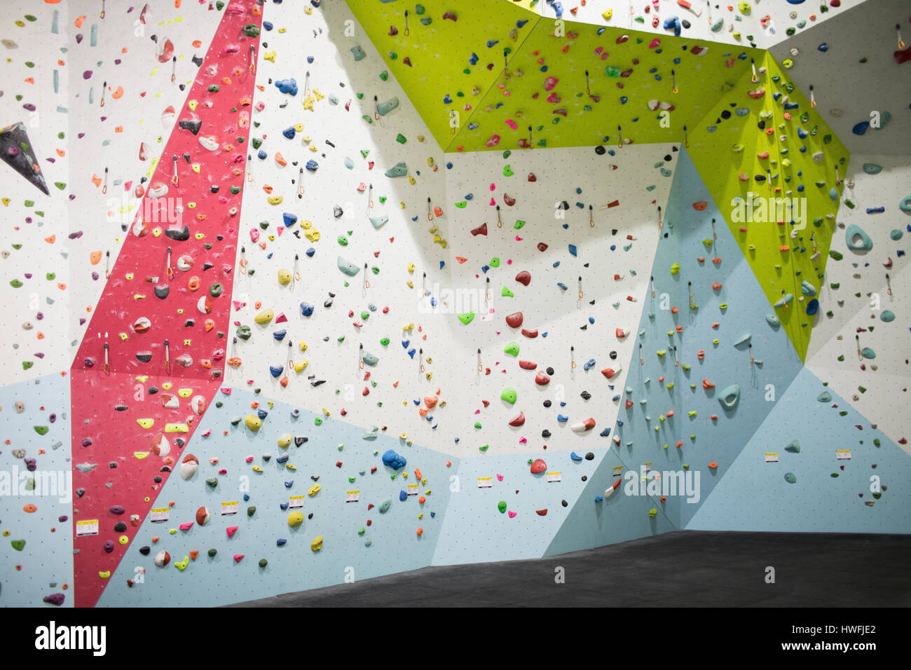 Artificial climbing wall in gym for practice Stock Photo Alamy