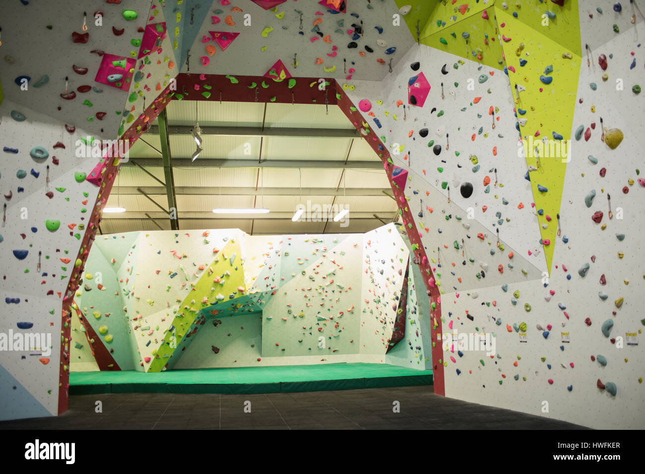 Artificial climbing wall in gym for practice Stock Photo