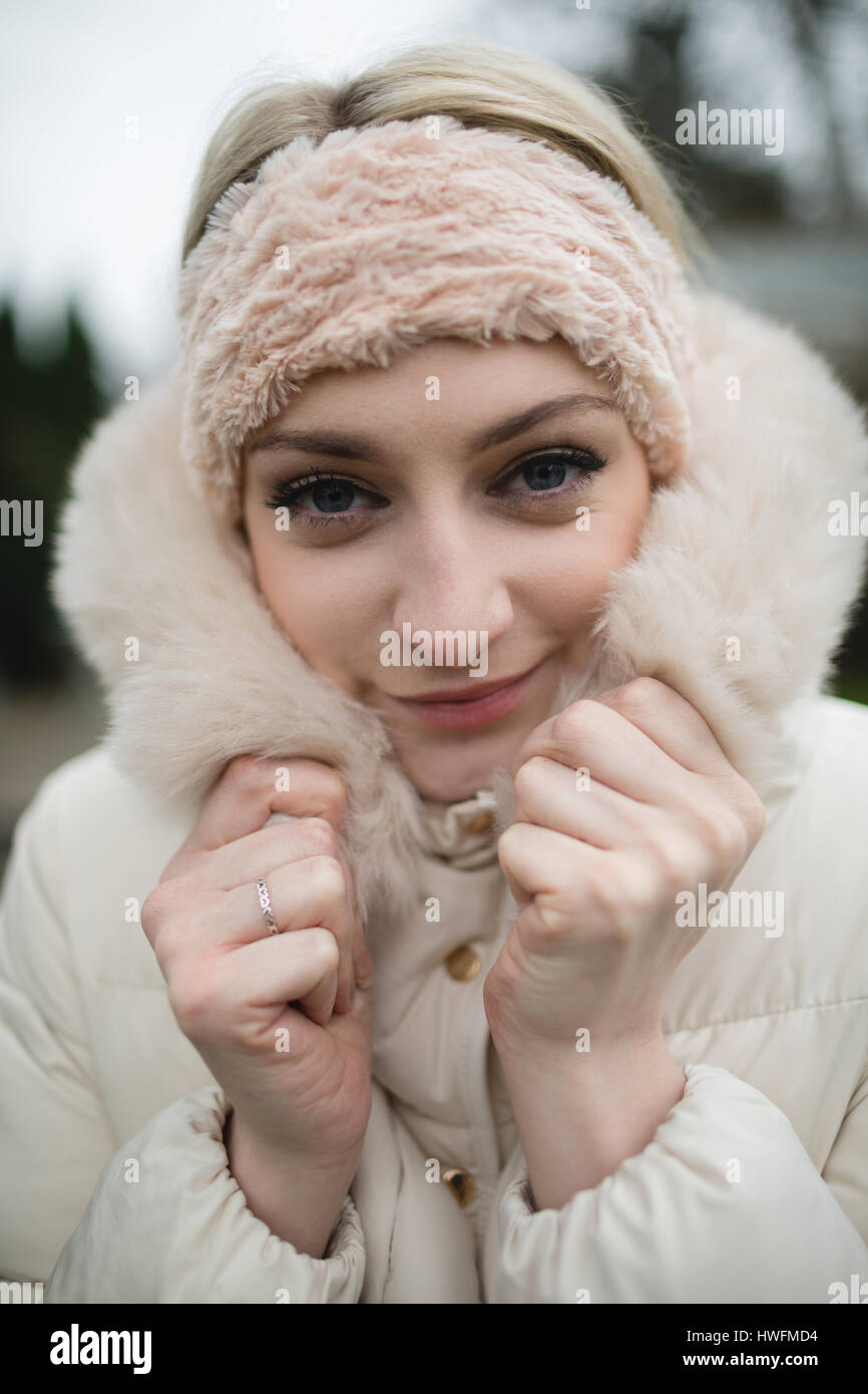 Portrait of woman in furry coat feeling cold Stock Photo