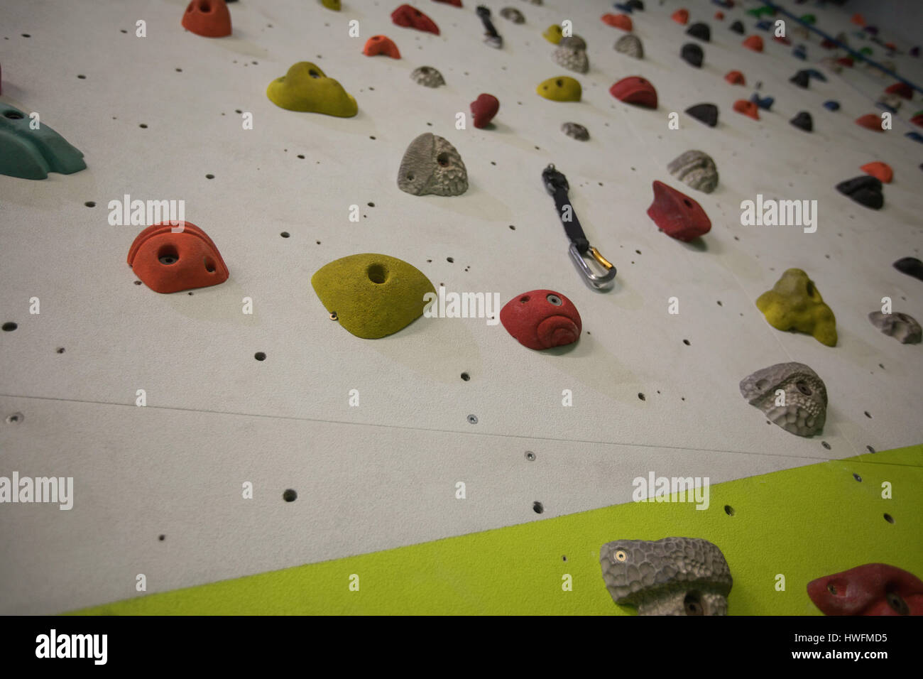 Artificial climbing wall in gym for practice Stock Photo