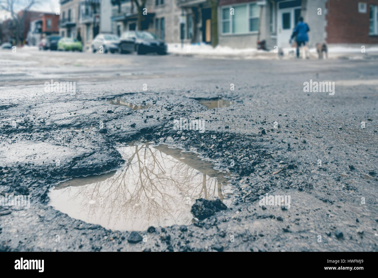 Large pothole in Montreal, Canada. Stock Photo