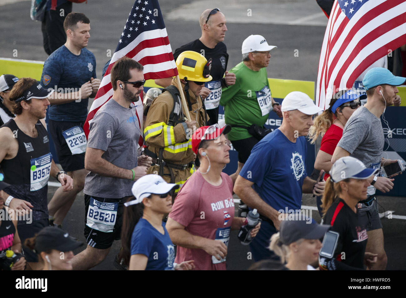 Los Angeles, CA, USA. 19th Mar, 2017. A firefighter runner wearing full turnout gear runs at the start of the 32nd annual Los Angeles Marathon at Dodger Stadium on Sunday morning, March 19, 2017 in Los Angeles, Calif. The 26.2-mile ''Stadium to the Sea'' route begins at Dodger Stadium and ends at Ocean and California avenues in Santa Monica. © 2017 Patrick T. Fallon Credit: Patrick Fallon/ZUMA Wire/Alamy Live News Stock Photo